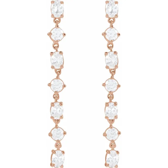 Front view of long alternating oval and round lab-grown diamond dangle earrings in 14K rose gold