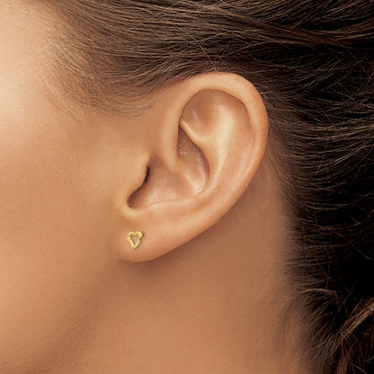 Children’s 14K yellow gold open heart stud earrings 5mm shown on ear