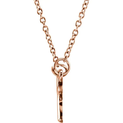Tiny Posh knotted bow necklace in 14K rose gold, side view