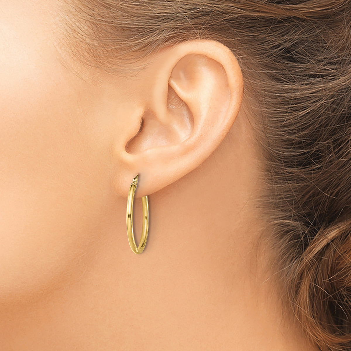 Classic 2mm gold-tone sterling silver hoop earrings, 25 mm — lifestyle view