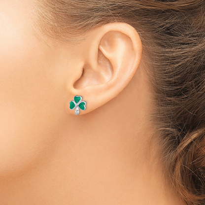 Children’s Green Enamel Shamrock Earrings shown on ear
