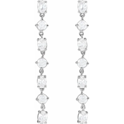 Front view of long alternating oval and round lab-grown diamond dangle earrings in rhodium-plated 14K white gold