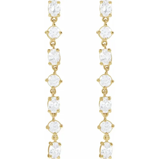 Front view of long alternating oval and round lab-grown diamond dangle earrings in 14K yellow gold