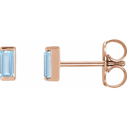 Lab-grown aqua sapphire baguette stud earrings in 14K rose gold, side view