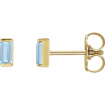 Lab-grown aqua sapphire baguette stud earrings in 14K yellow gold, side view