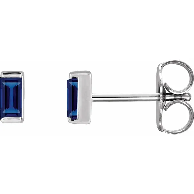 Lab-grown blue sapphire baguette stud earrings in white metal, side view