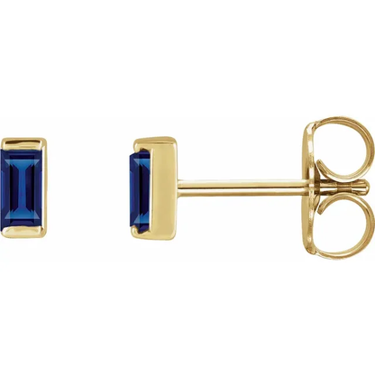 Lab-grown blue sapphire baguette stud earrings in 14K yellow gold, side view