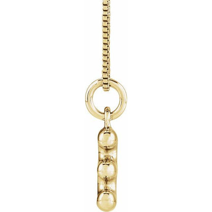 Bubble initial E necklace in yellow metal, side view