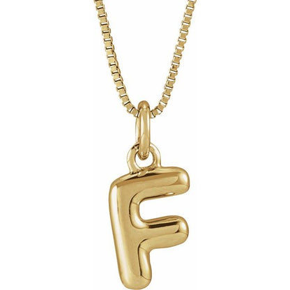 Bubble initial F necklace in yellow metal, front view