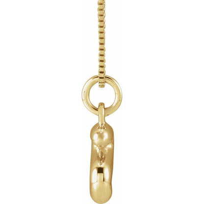 Bubble initial S necklace in yellow metal, side view