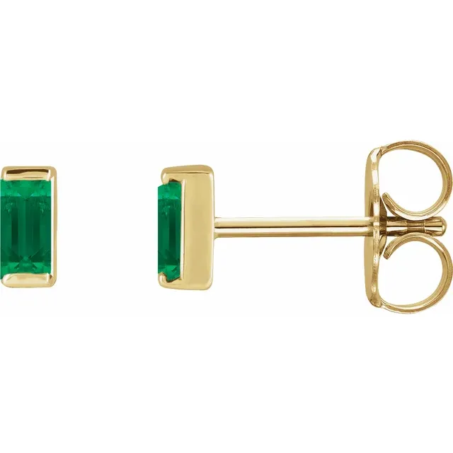 Lab-grown emerald baguette stud earrings in 14K yellow gold, side view