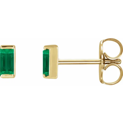 Lab-grown emerald baguette stud earrings in 14K yellow gold, side view