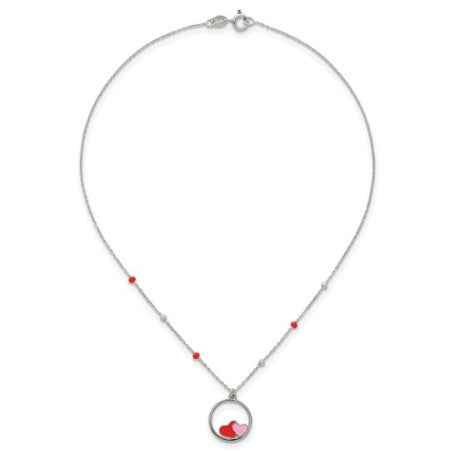 Red and pink enameled hearts necklace arranged flat