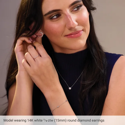 Model wearing 15mm white gold front-back lab-grown diamond earrings to show their scale on the ear