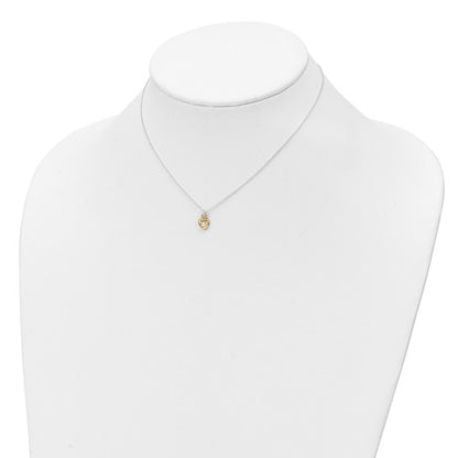 Gold-tone CZ heart children's necklace shown on a display bust