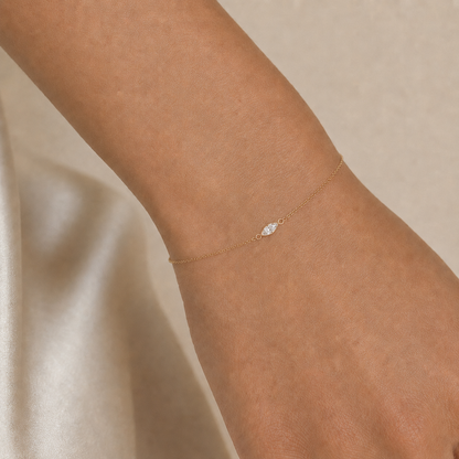 Model wearing the 1/4 CT marquise lab-grown diamond bracelet in yellow gold