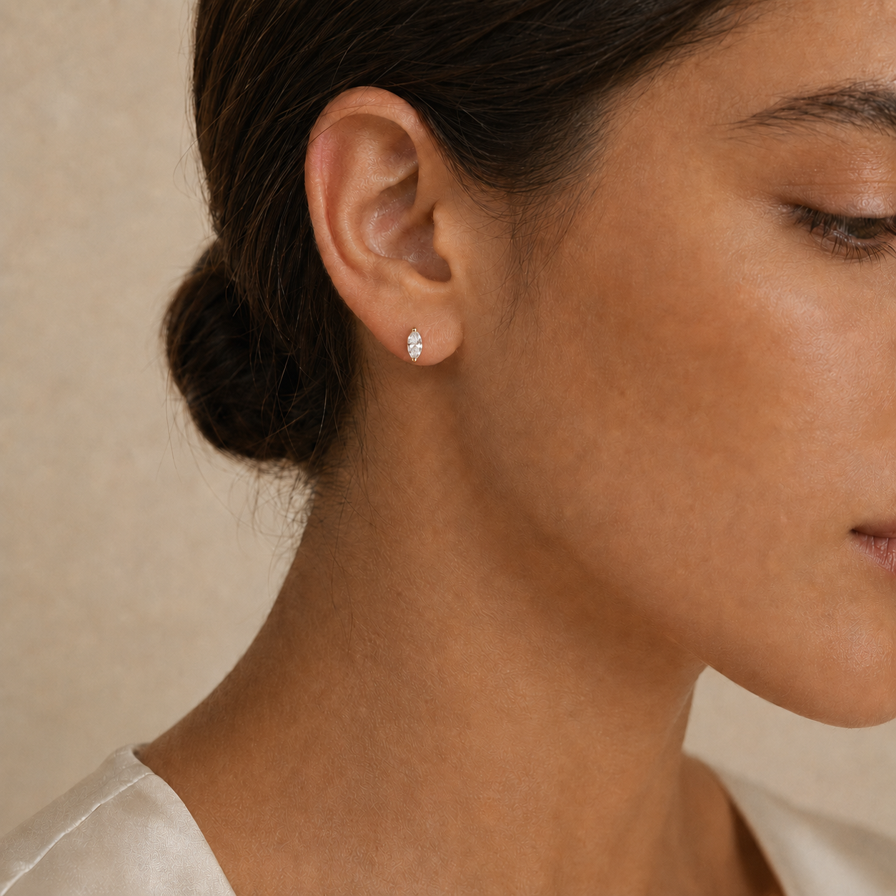 Model wearing 1/3 CTW marquise lab-grown diamond stud earrings