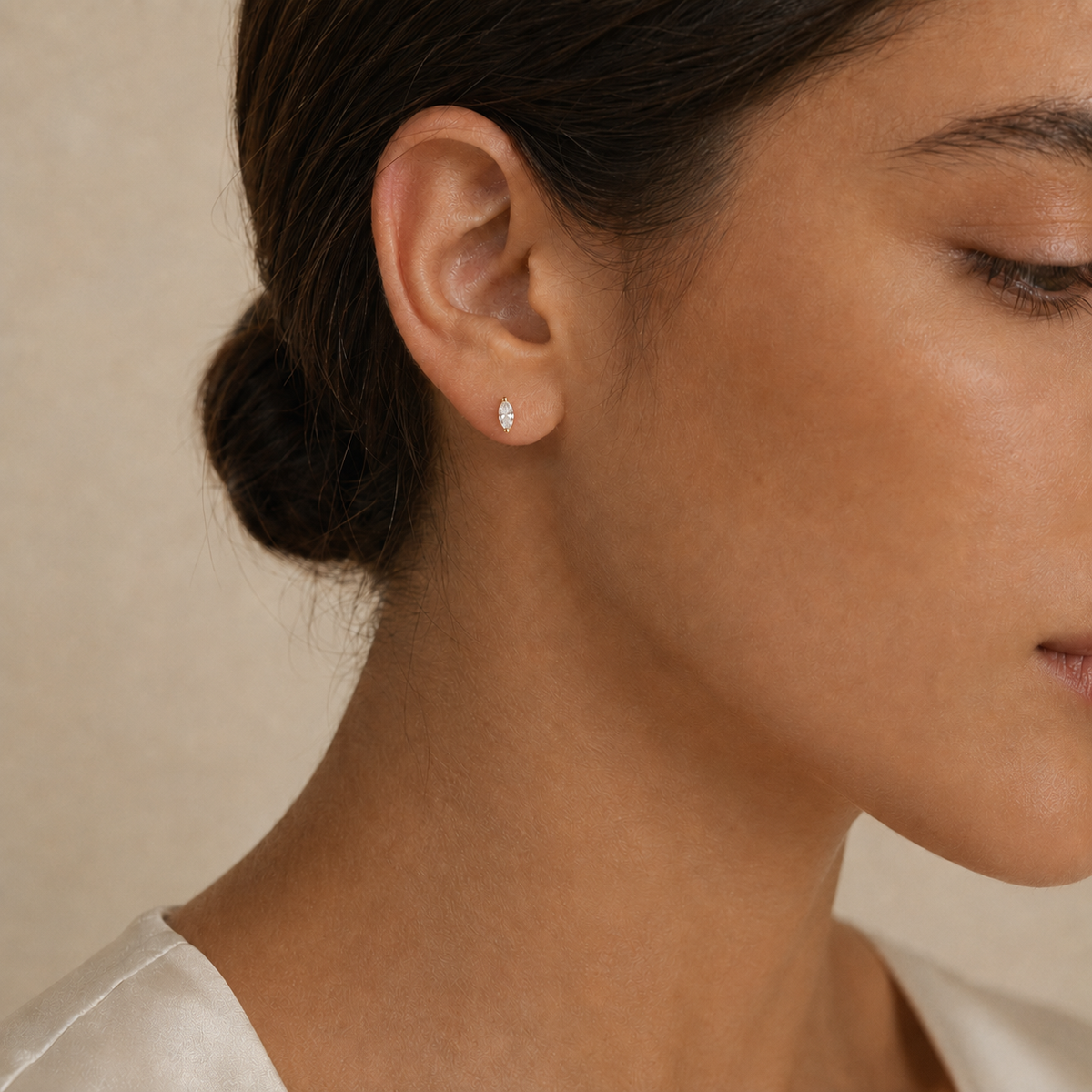 Model wearing the selected marquise stud earring size