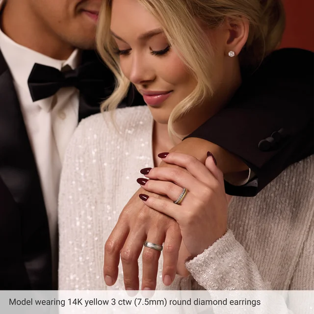 Lifestyle view of 3 CTW round lab-grown diamond stud earrings in 14K yellow gold, approximately 7.5 mm