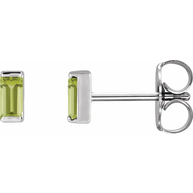 Natural peridot baguette stud earrings in white metal, side view