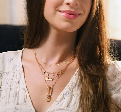 Personalized script name necklace worn layered