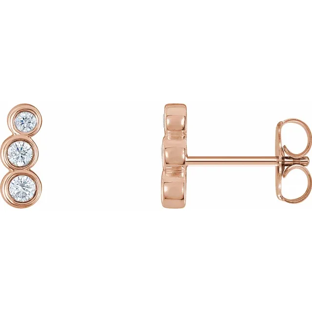 14K rose gold petite natural diamond ear climbers shown from the front and side
