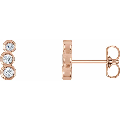 14K rose gold petite natural diamond ear climbers shown from the front and side