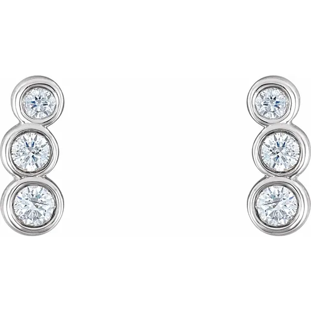 Front view of 14K white gold petite ear climbers with three graduated natural diamonds