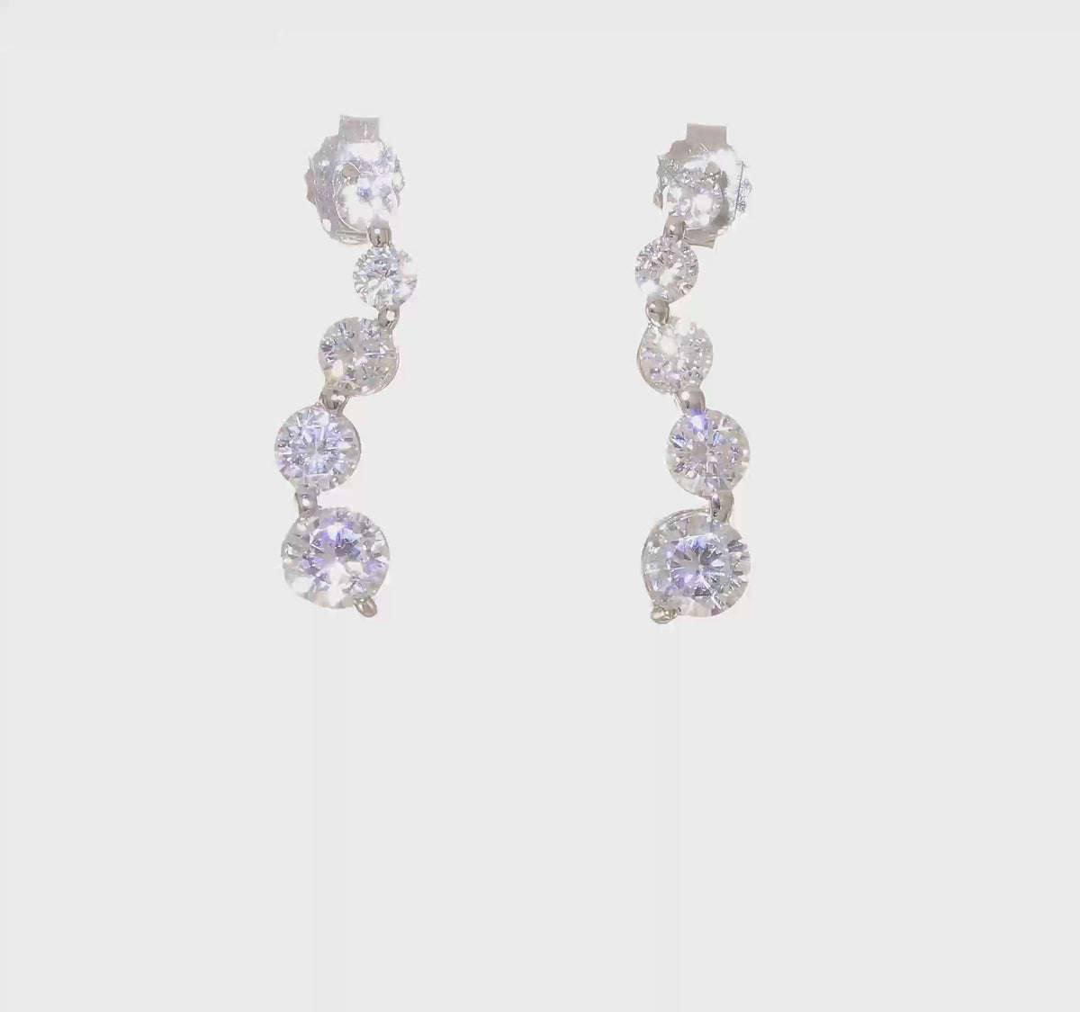 Sterling silver graduated cubic zirconia journey drop earrings video