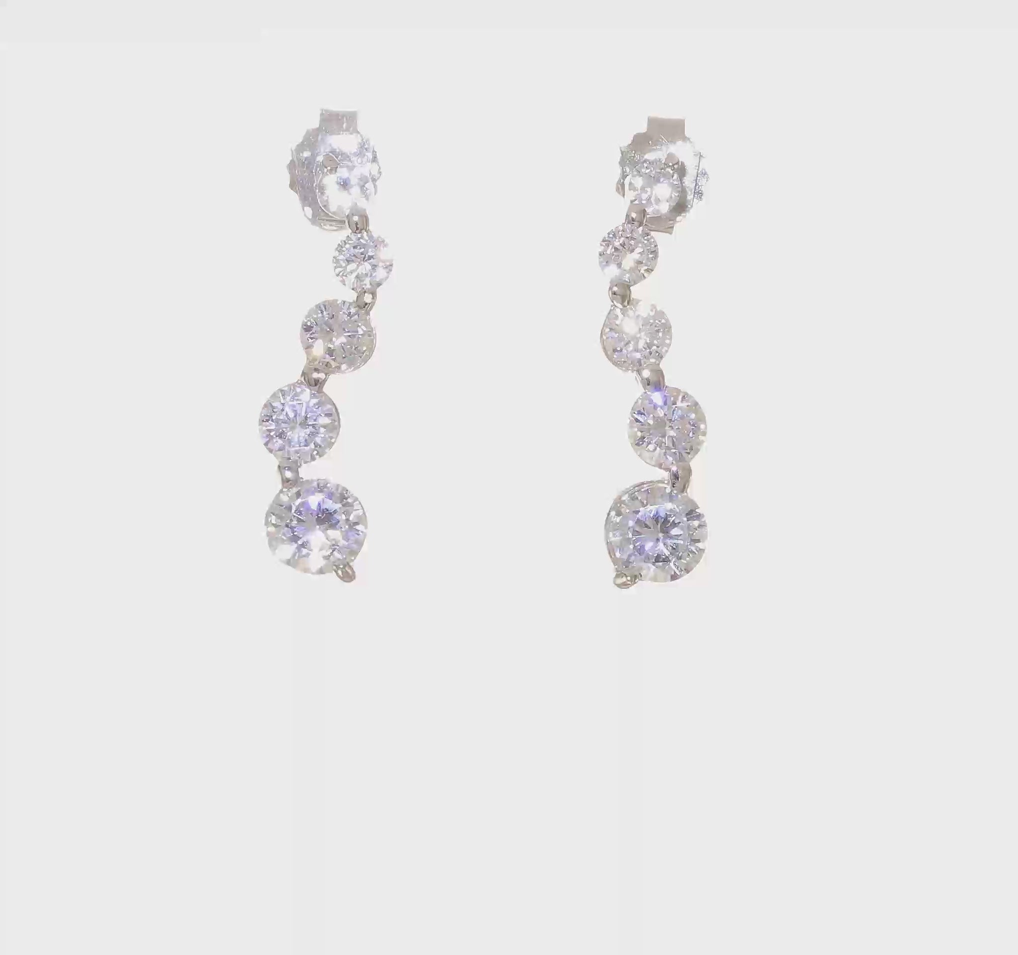 Sterling silver graduated cubic zirconia journey drop earrings video