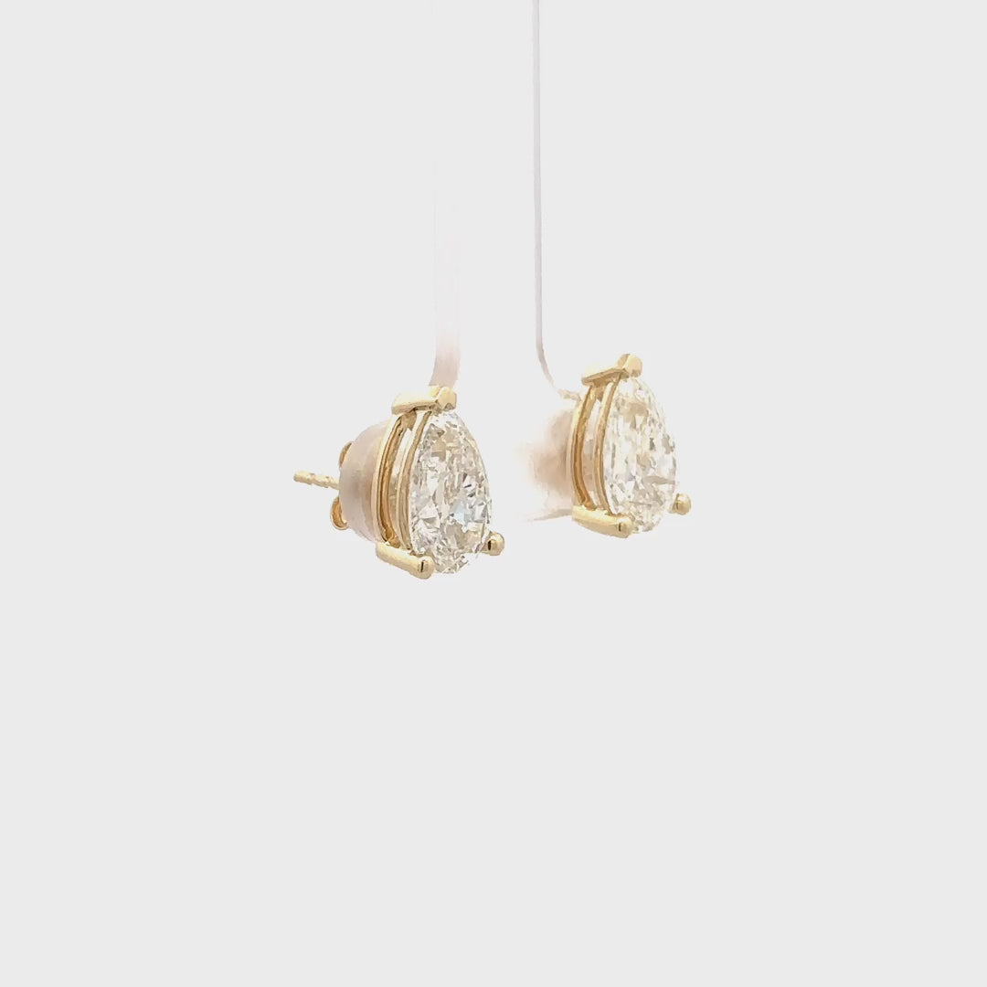 4 CTW Pear Lab-Grown Diamond Stud Earrings in yellow gold video