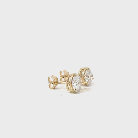 1.5 CTW round lab-grown diamond stud earrings in yellow gold video