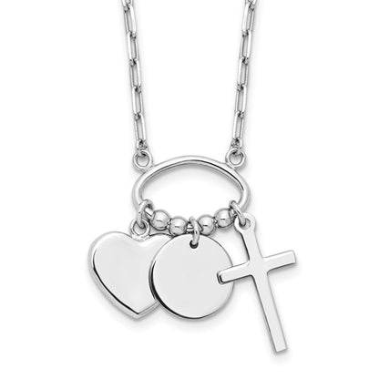 Sterling silver heart disc and cross charm necklace close-up