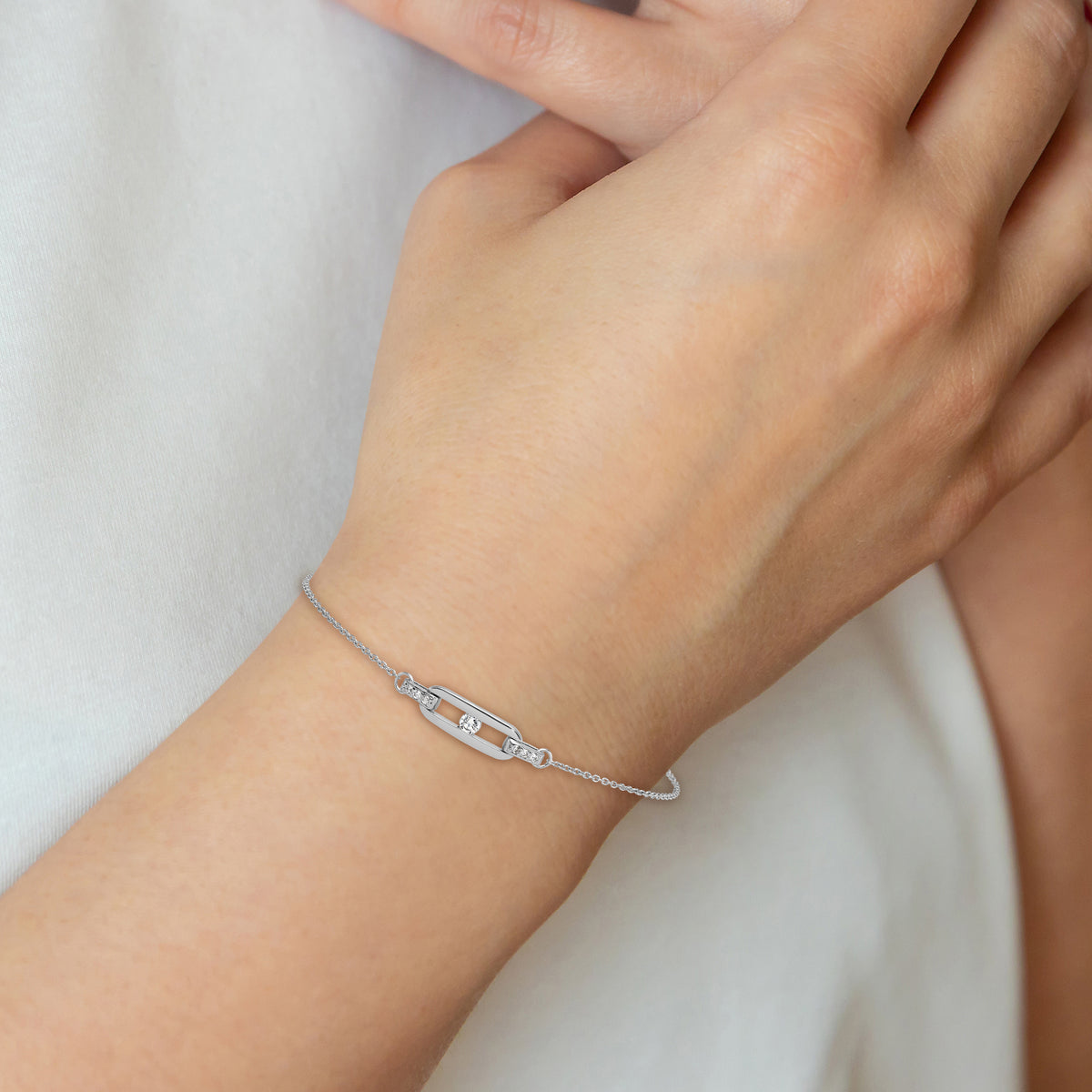 Delicate sterling silver CZ oval-link bracelet measurement guide