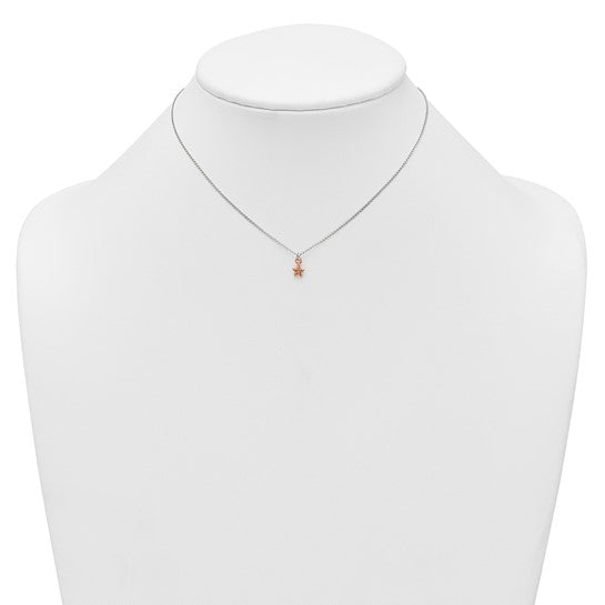 Rose-tone CZ star children's necklace shown on a display bust