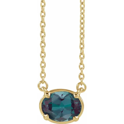 Front view of oval lab-grown alexandrite necklace in 14K yellow gold vermeil