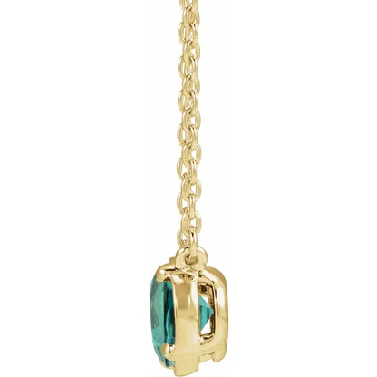 Side view of oval lab-grown alexandrite necklace in 14K yellow gold vermeil