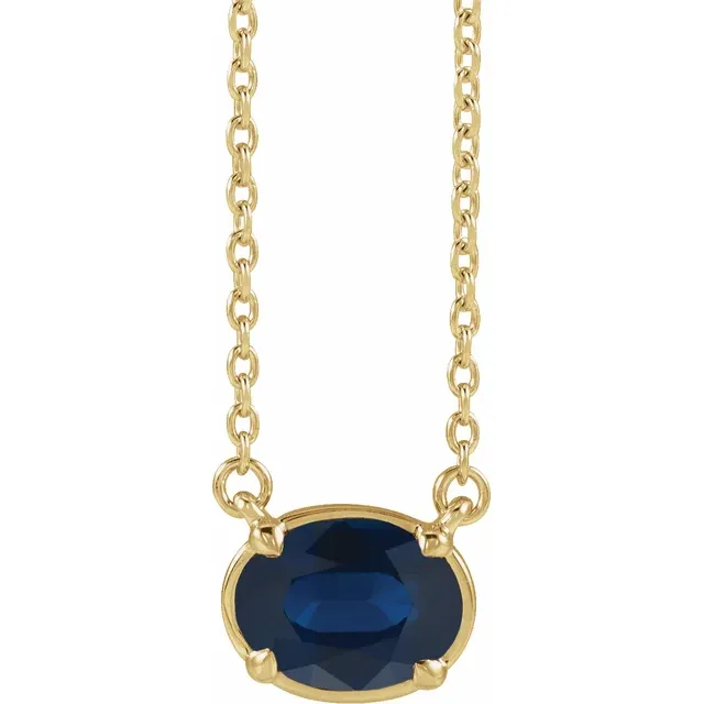 Front view of oval lab-grown blue sapphire necklace in 14K yellow gold vermeil