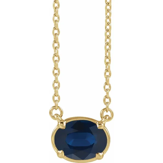 Front view of oval lab-grown blue sapphire necklace in 14K yellow gold vermeil