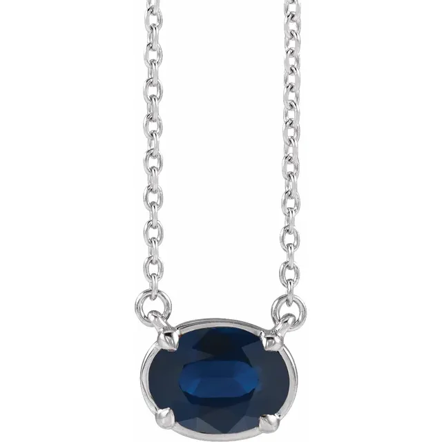 Front view of oval lab-grown blue sapphire necklace in sterling silver