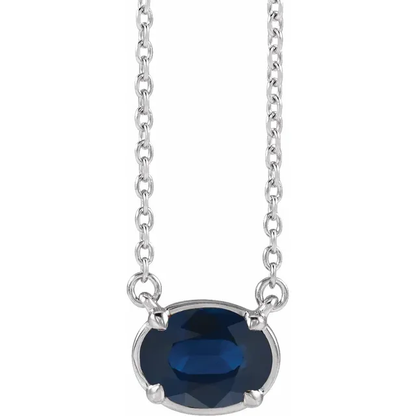 Front view of oval lab-grown blue sapphire necklace in sterling silver