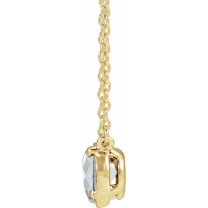 Side view of oval lab-grown diamond necklace in 14K yellow gold vermeil