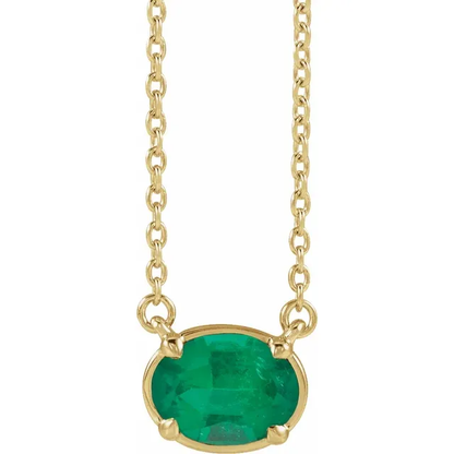 Front view of oval lab-grown emerald necklace in 14K yellow gold vermeil