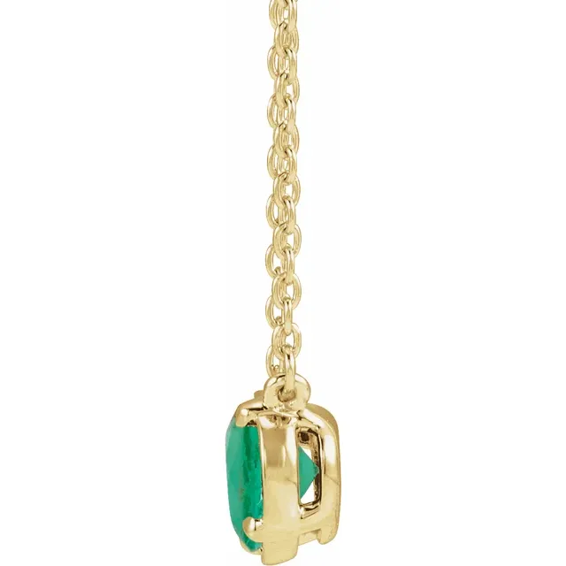Side view of oval lab-grown emerald necklace in 14K yellow gold vermeil