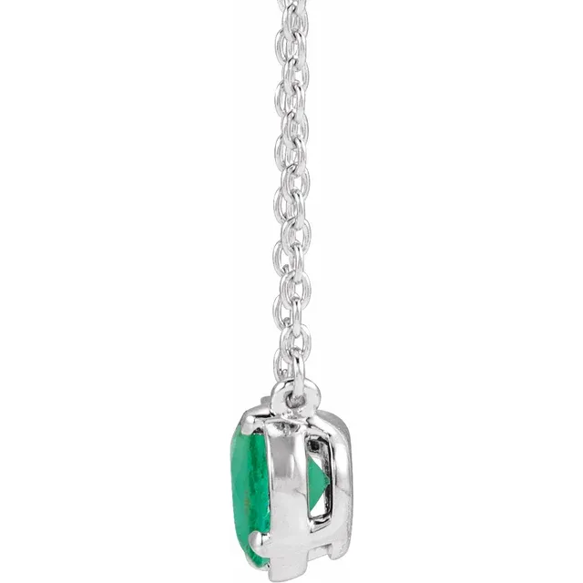Side view of oval lab-grown emerald necklace in sterling silver