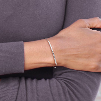Sterling silver adjustable bar bolo bracelet worn on the wrist