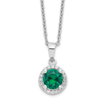 Close-up of sterling silver green and white cubic zirconia halo necklace