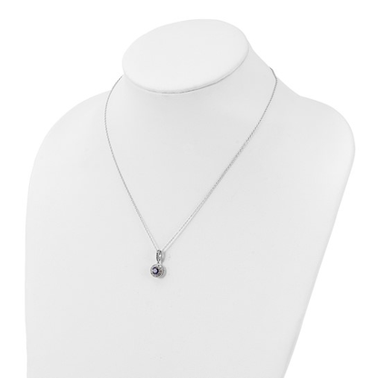 Sterling silver purple and white cubic zirconia halo necklace shown on display bust