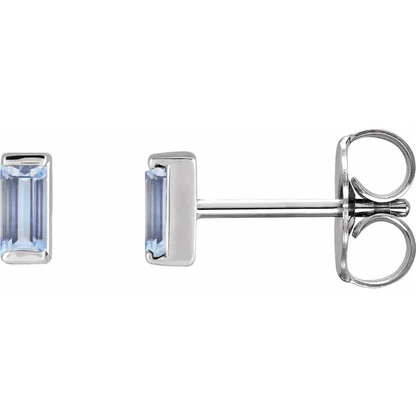Natural tanzanite baguette stud earrings in white metal, side view