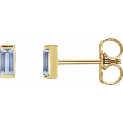 Natural tanzanite baguette stud earrings in 14K yellow gold, side view